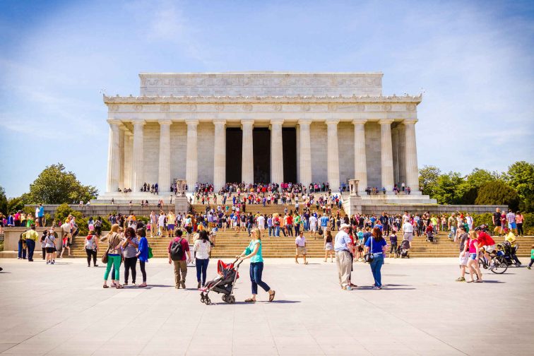 Tourists Stroll in Front of Lincoln Memorial in Washington, D.C.; Courtesy of Destination DC