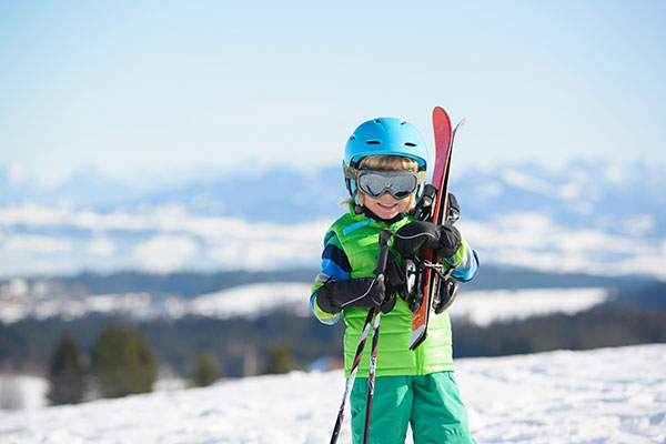 Young Boy With Skiis