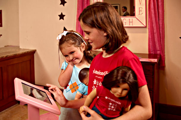 Young girls enjoying an American Girl Doll hotel package