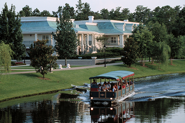 A river boat passing by Disney's Port Orleans Riverside Resort.