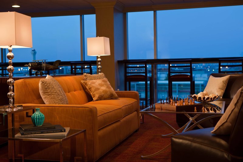 a living room with a couch and a chess board