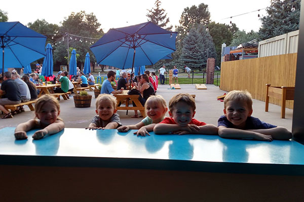 A group of kids having fun at Intersect Brewing in Fort Collins, Colorado.