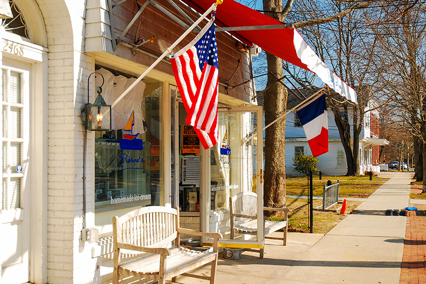 a French cafe flies the tri-colors in East Hampton, New York; Courtesy of James Kirkikis/Shutterstock