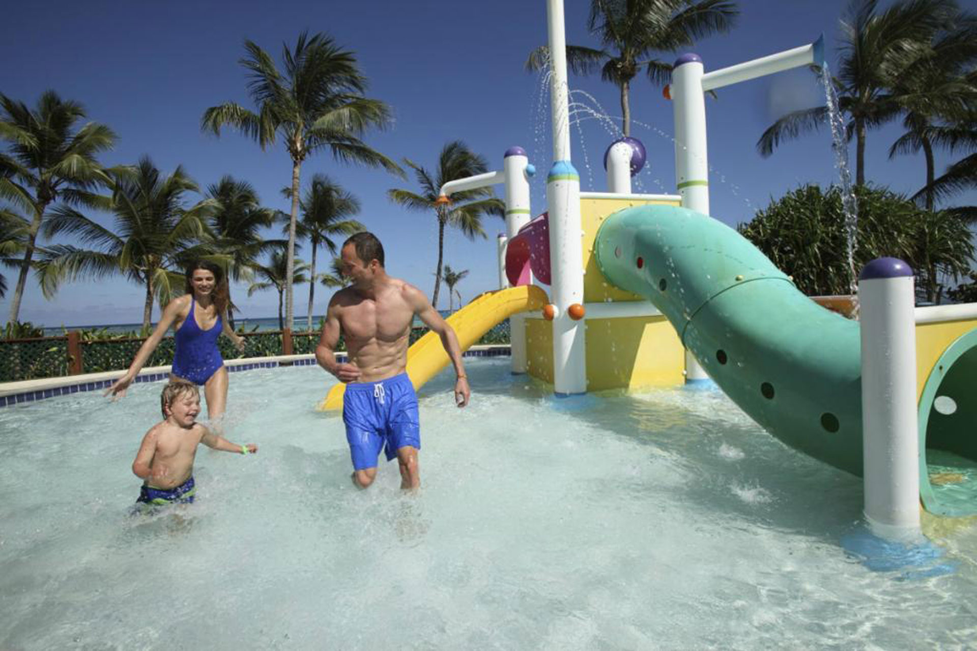 Parents and child at the water park at Club Med Punta Cana