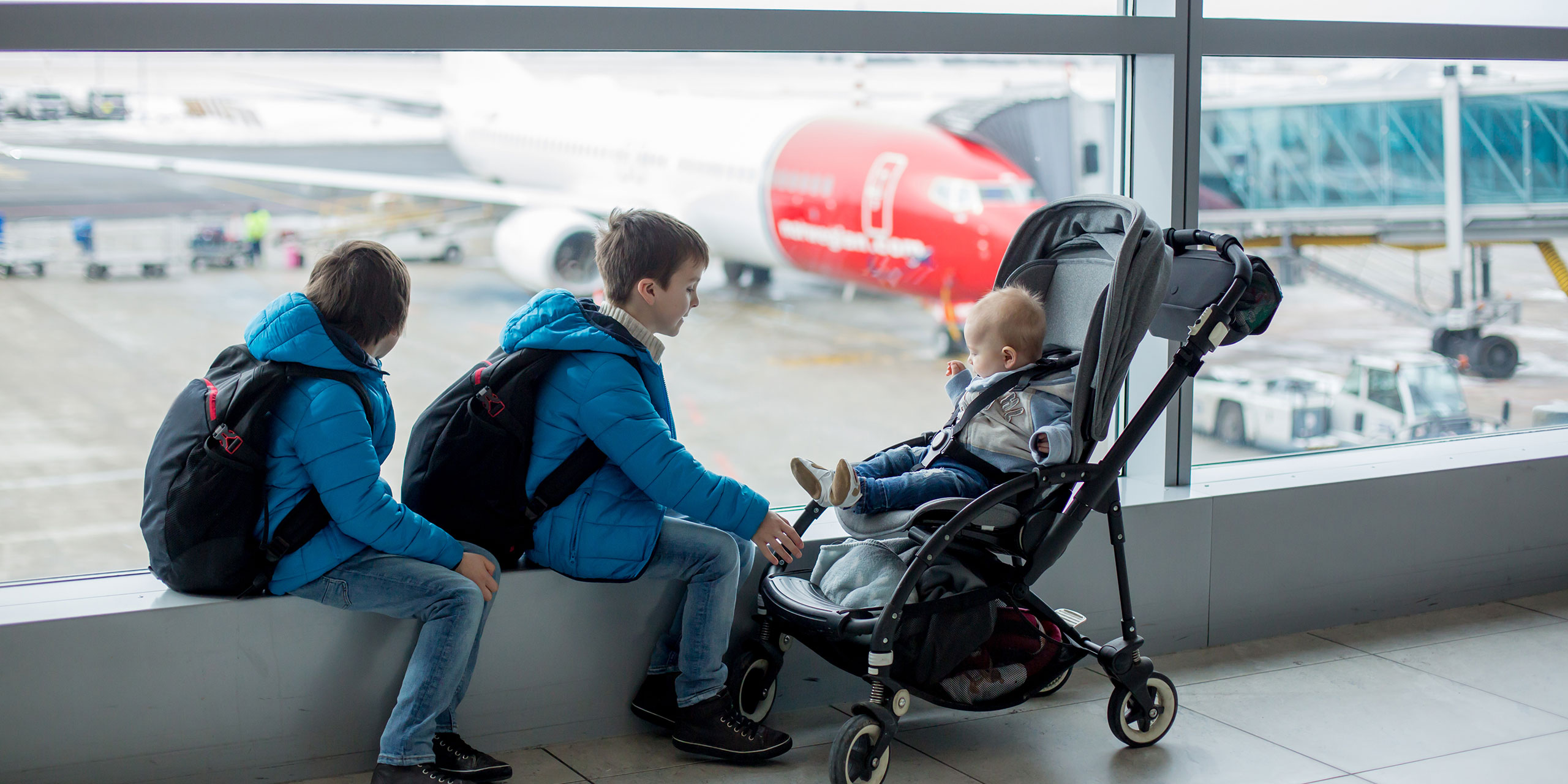Kids with Stroller at Airport; Courtesy of Tomsickova Tatyana/Shutterstock.com
