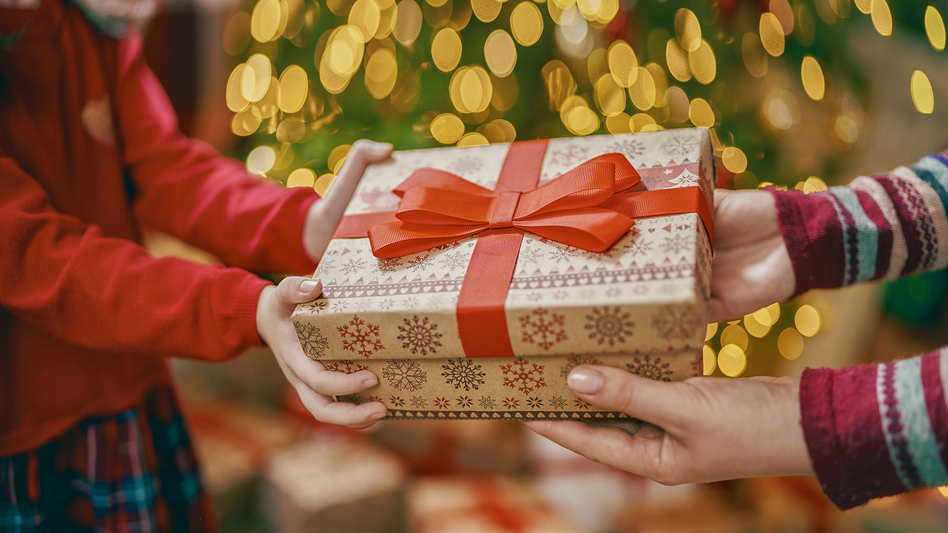 giving gift holiday chritsmas tree; Courtesy of Yuganov Konstantin/Shutterstock