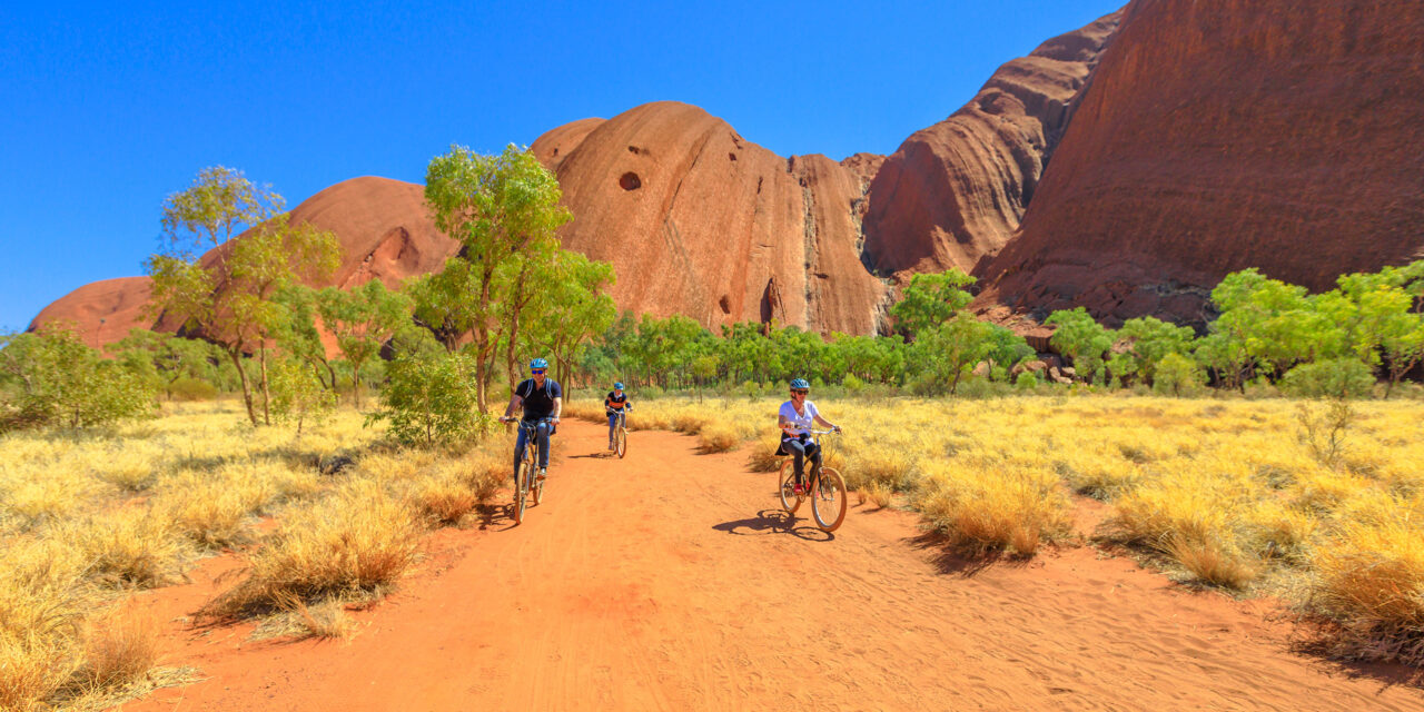 family discovery Ayers Rock with Outback Cycling Ride along Uluru Base Walk in Uluru-Kata Tjuta National Park; Courtesy of Benny Marty/Shutterstock