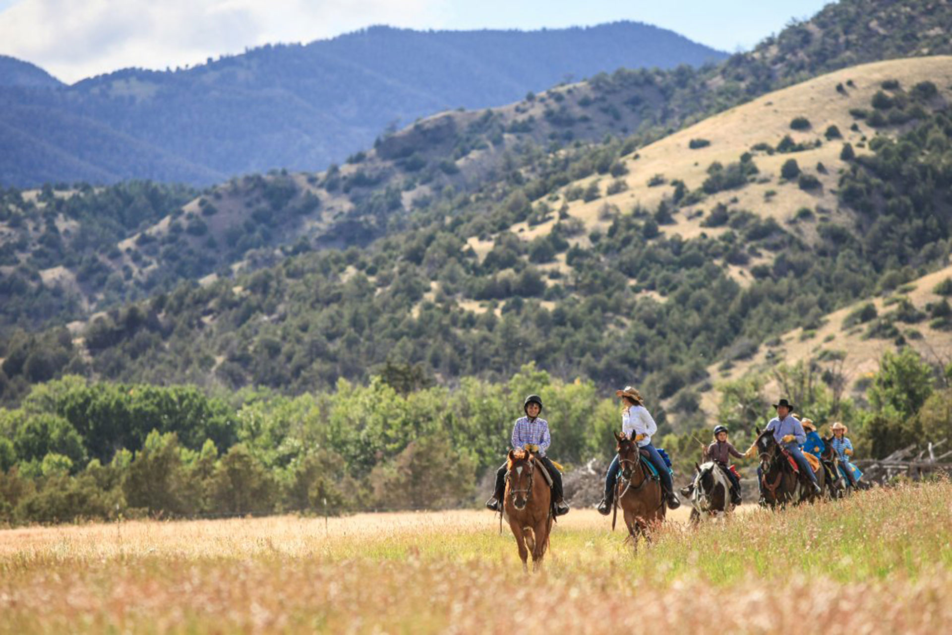 Family Horseback Riding at Mountain Sky Guest Ranch in Emigrant, Montana; Courtesy of Mountain Sky Guest Ranch