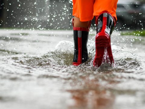 Rainboots In Rain Puddle; Courtesy of Joy Youell/Shutterstock.com