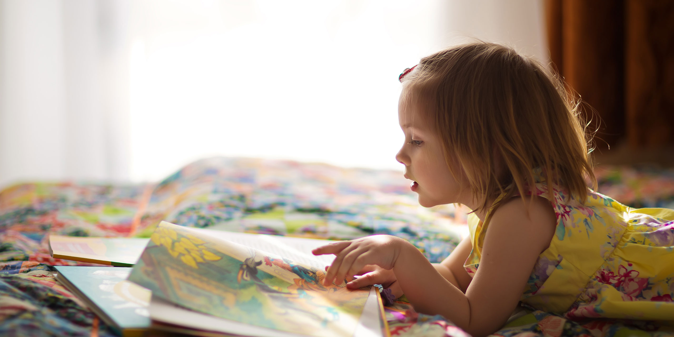 Young Girl Reading; Courtesy of Tatiana Bobkova/Shutterstock.com