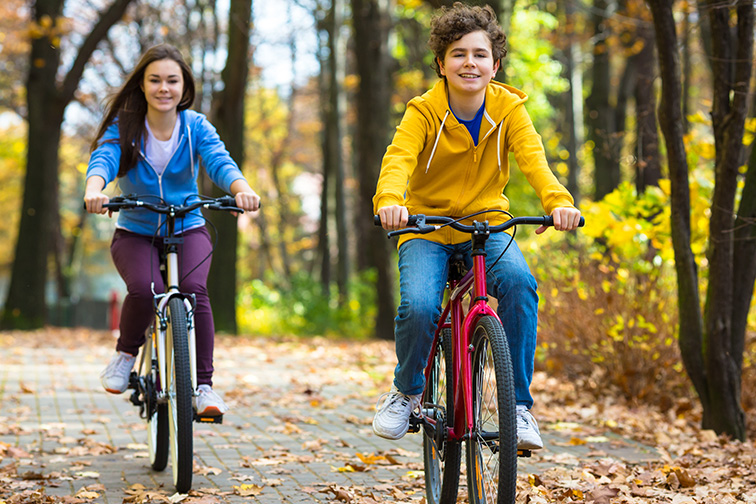 teens and bikes in city park ; Courtesy of Jacek Chabraszewski/Shutterstock