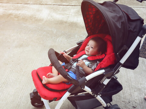 mom in a red stroller; Courtesy of Shutterstock