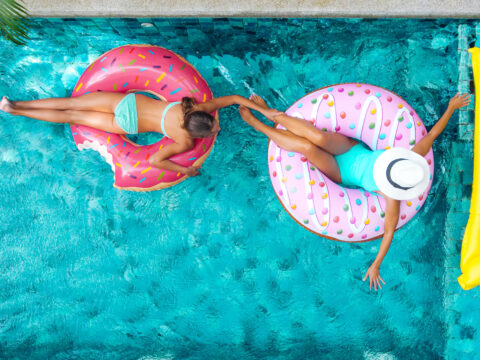 Mom and Daughter in Pool; Courtesy of Alena Ozerova/Shutterstock.com