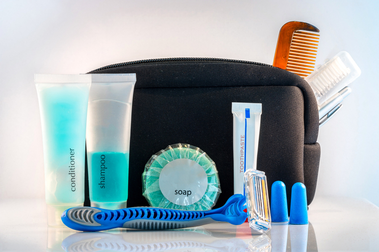 Toiletry bag with shampoo, soap, razor, combs, earplugs and toothpaste