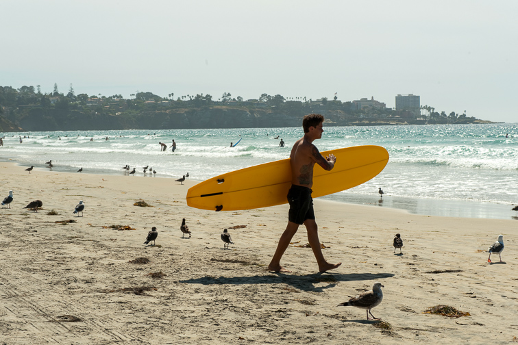 San Diego beach surfer; Courtesy Visit California
