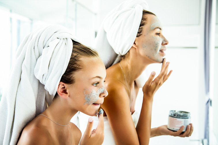 teen and mom putting on clay facemask; Courtesy Alena Ozerova/Shutterstock