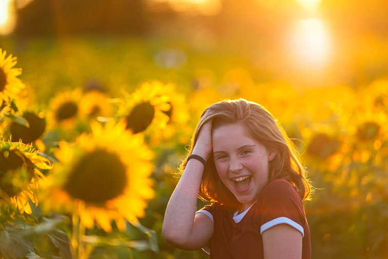 Young Girl in Field of Sunflowers; Courtesy of Jeff Bogle