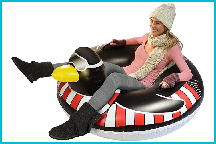 Woman sitting in a GoFloat Penguin snow tube