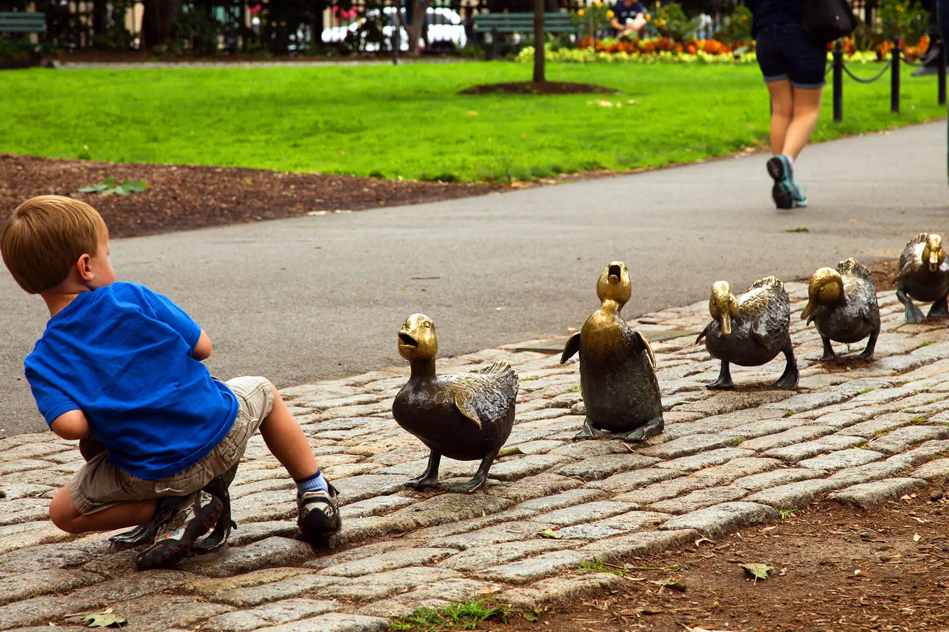Little Boy Playing With Boston Ducks; Courtesy of Greater Boston Convention & Visitors Bureau
