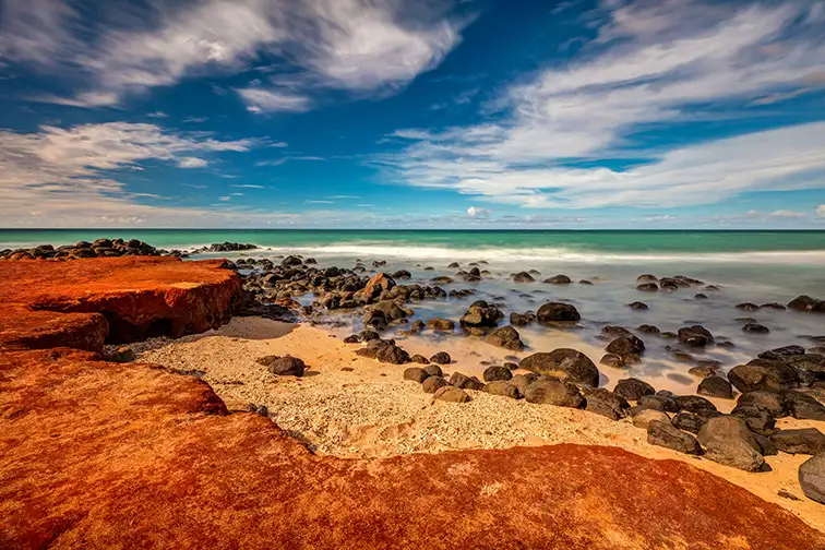Maui Red Dirt at Baby Beach On the North shore of Maui, Hawaii; Courtesy of Pierre Leclerc/Shutterstock