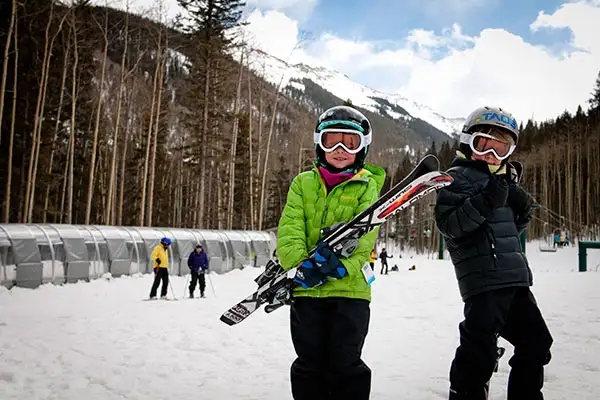 Two kids getting ready to hit the slopes at Taos Ski Valley in New Mexico.; Courtesy of Thatcher Dorn/Taos Ski Valley