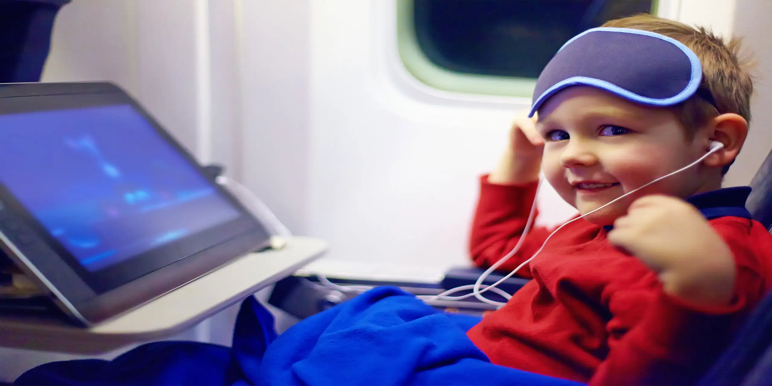 Kid On Plane; Courtesy of Olesia Bilkei/Shutterstock.com