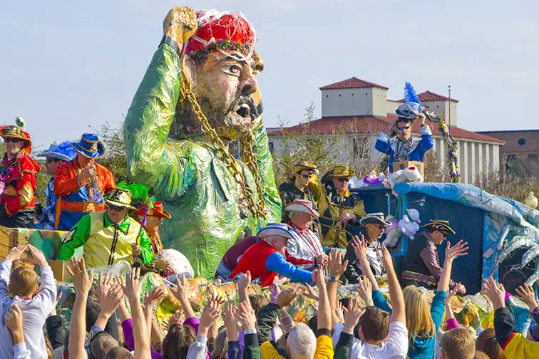  Revelers beg for beads at the Grand Mardi Gras parade in Pensacola; Courtesy of Cheryl Casey/Shutterstock