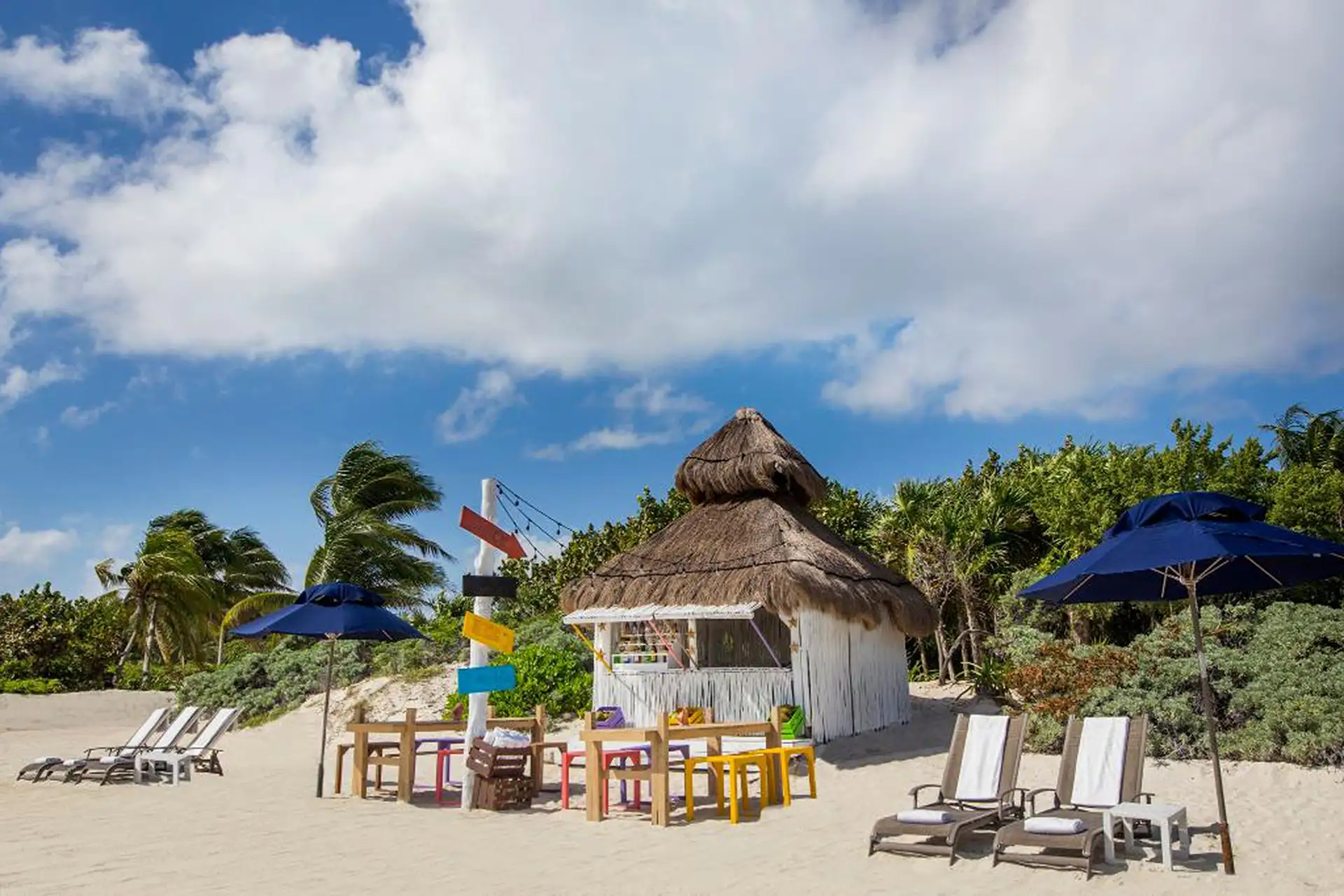 Banyan Tre Mayakoba, hut on the beach with umbrellas and beach chairs