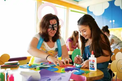 Young Girl Plays with Arts and Crafts on Norwegian Cruise Line