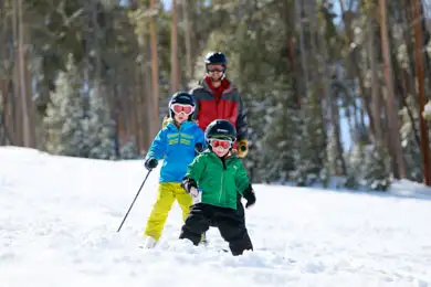 A family making some serious turns down the mountain at Granby Ranch in Colorado.