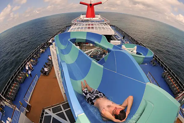 A man going down one of the waterslides on board Carnival Splendor.