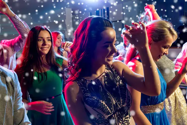 Teenagers having fun at a disco dance.