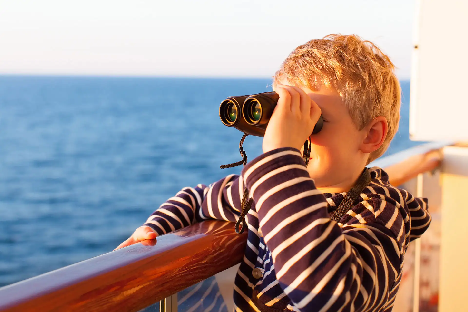 Young Boy With Binoculars on Cruise