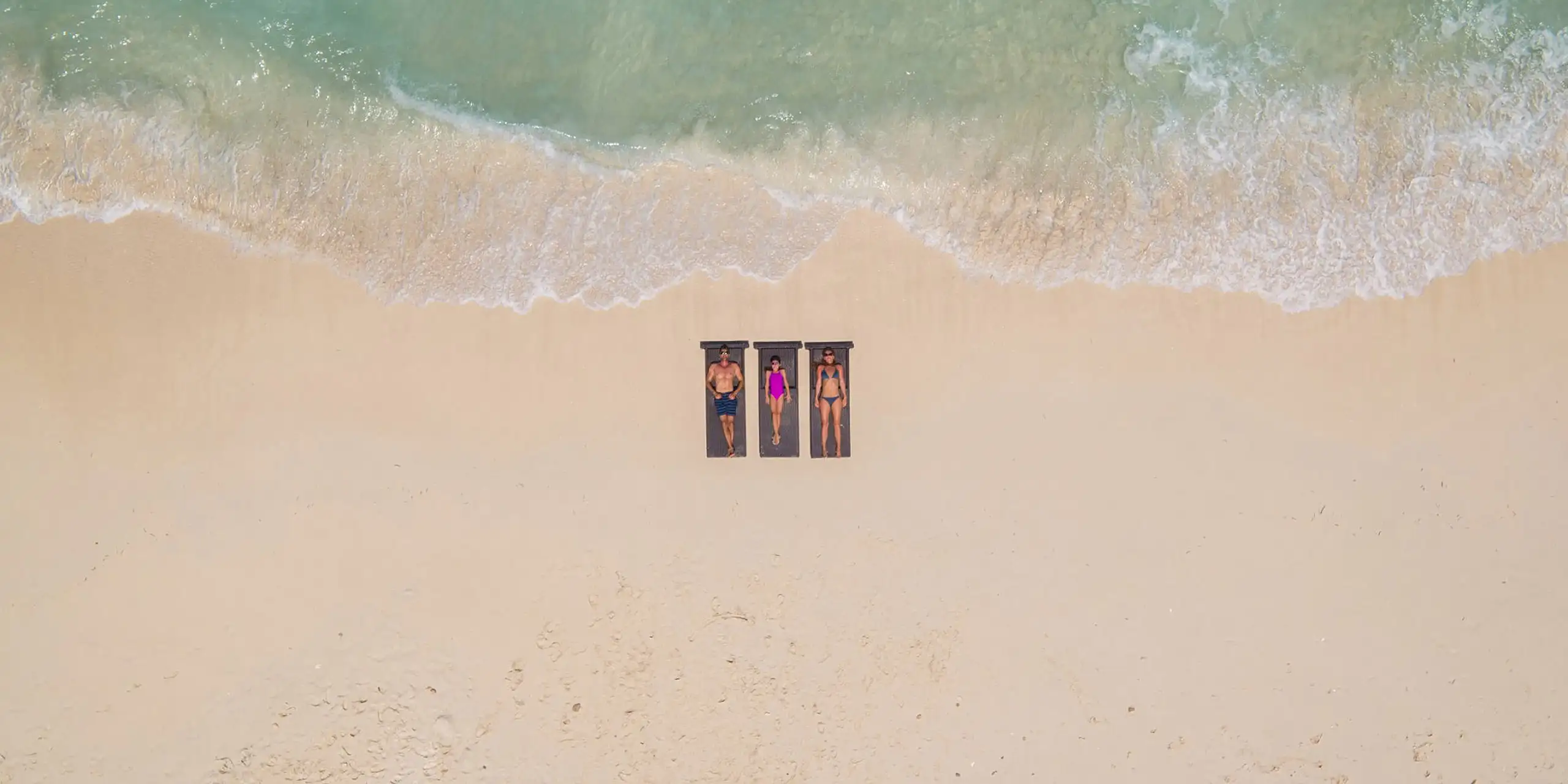 Aerial View of Family on Beach at Resorts World Bimini; Courtesy of Resorts World Bimini