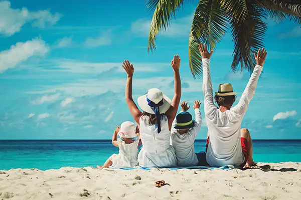 A family enjoying their beach vacation.