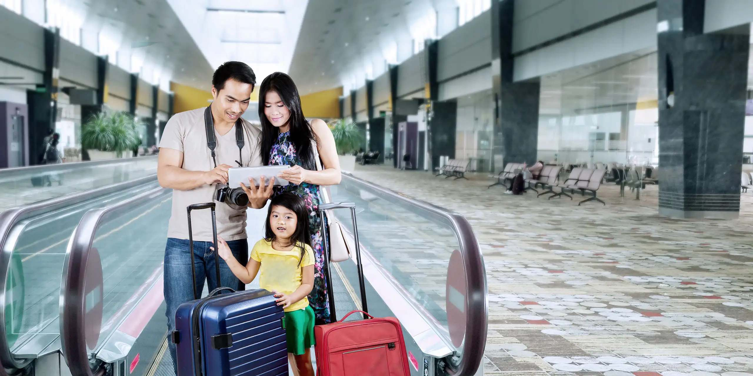 Asian Family at Airport: Courtesy of Creativa Images/Shutterstock.com