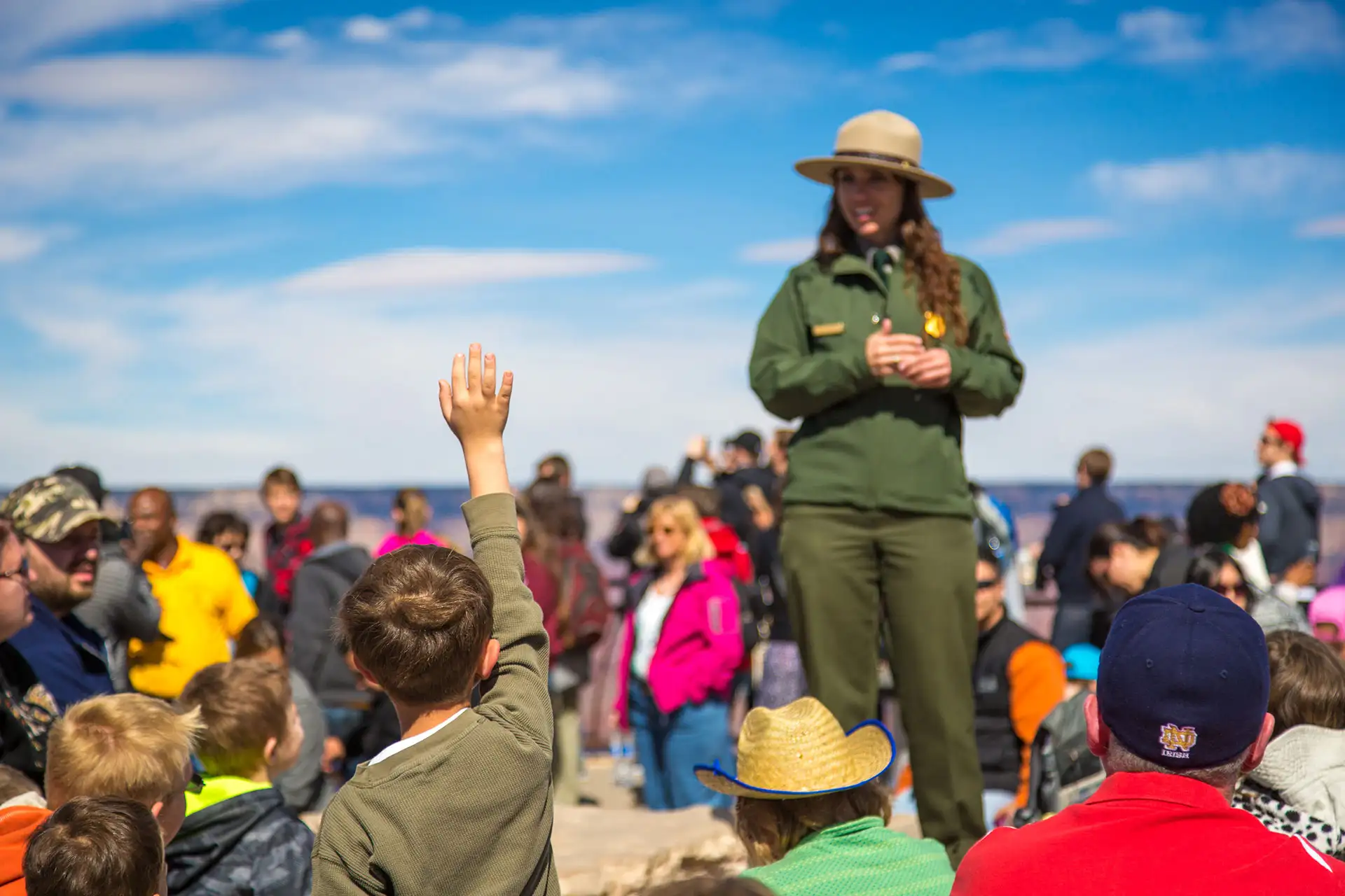 A park ranger replying to a kid's question in the south rim of Grand Canyon National Park, Arizona