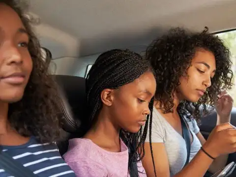 Teen Girls on Road Trip; Courtesy of Monkey Business Images/Shutterstock.com