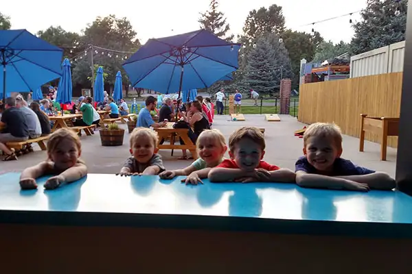 A group of kids having fun at Intersect Brewing in Fort Collins, Colorado.