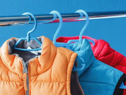 Winter Vests Hanging in a Closet; Courtesy of PicMy/Shutterstock