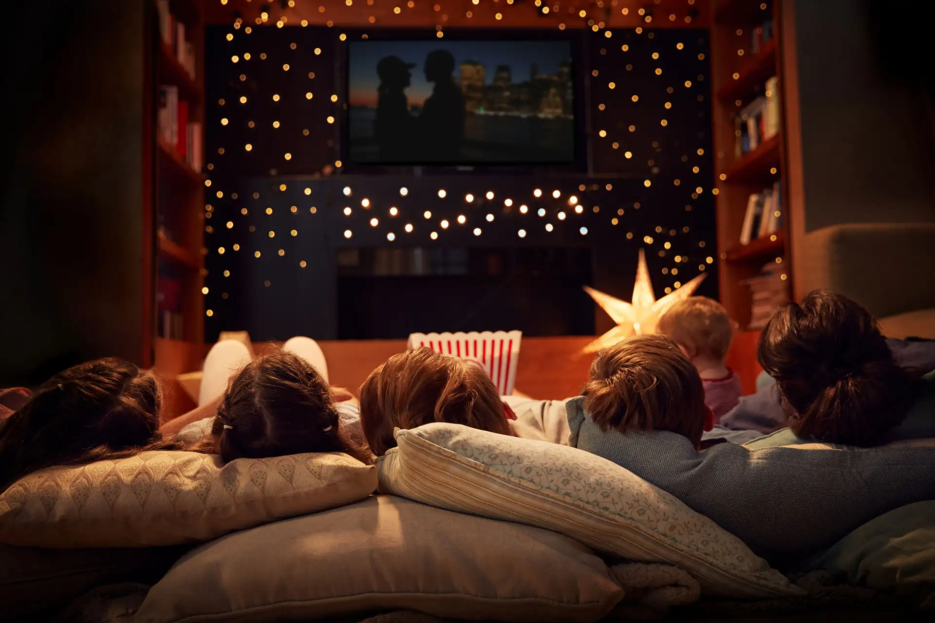 A family enjoying a movie night at home.