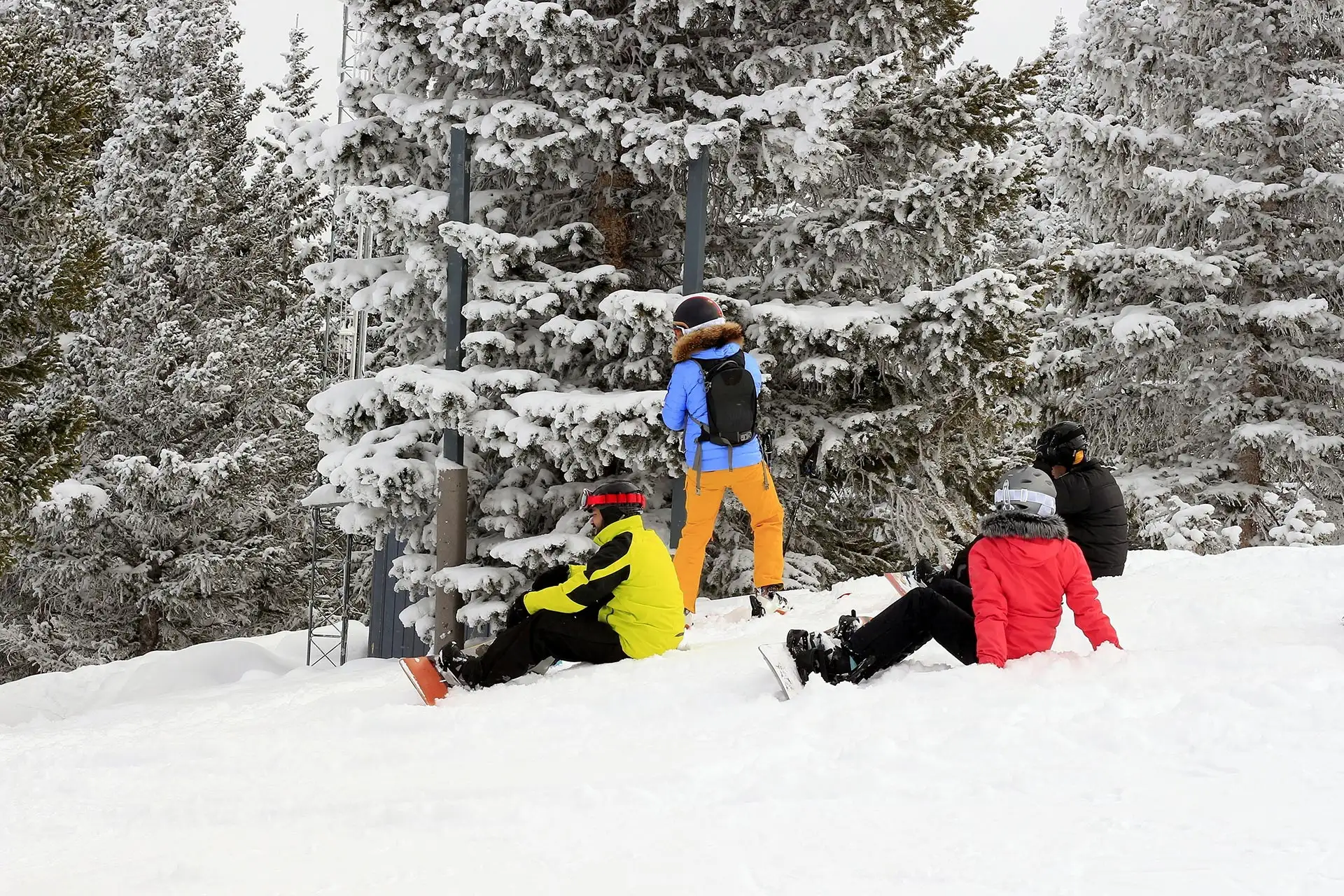 A group of teens taking a break on the mountain at Snowmass in Colorado.