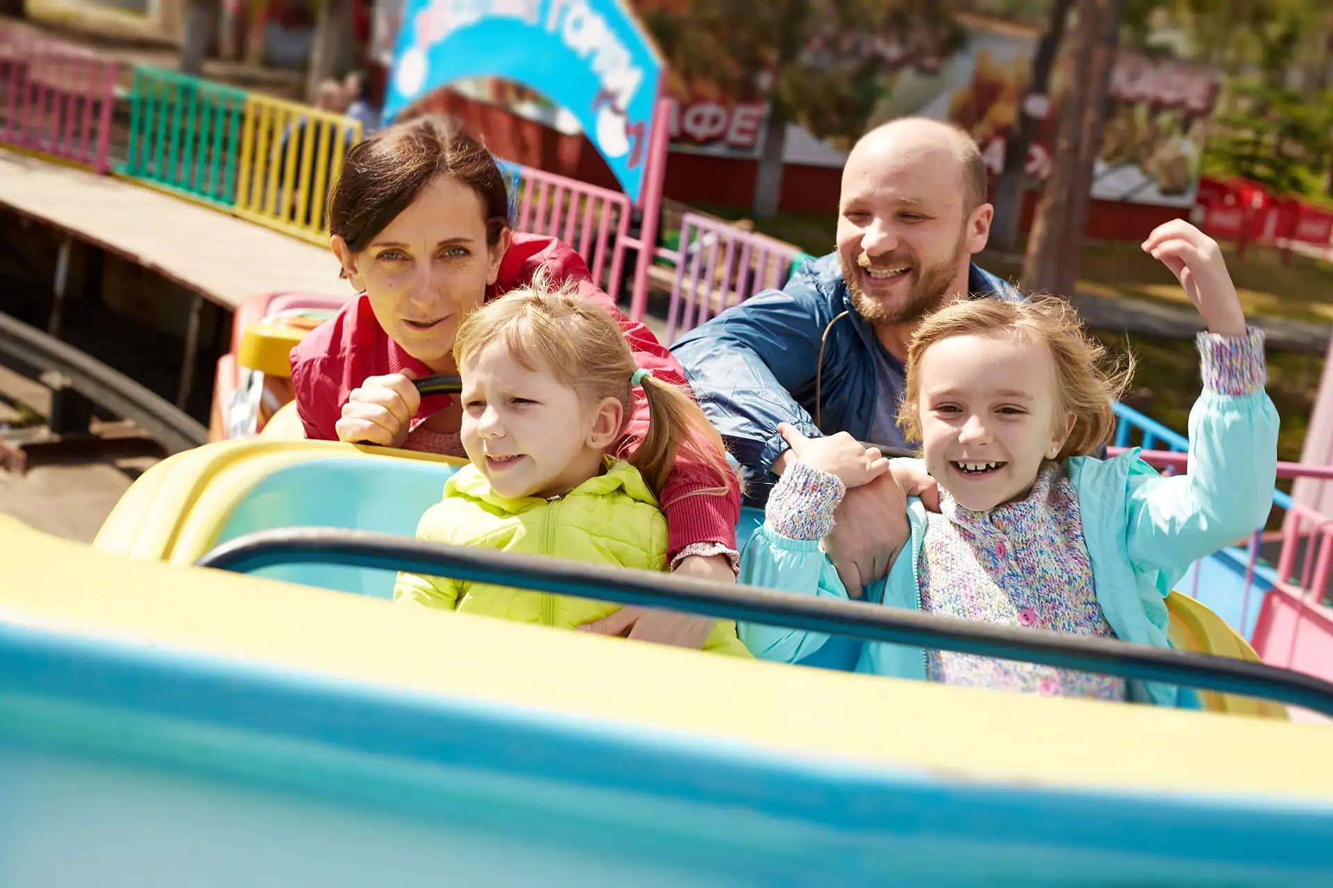 Family of Four at Amusement Park