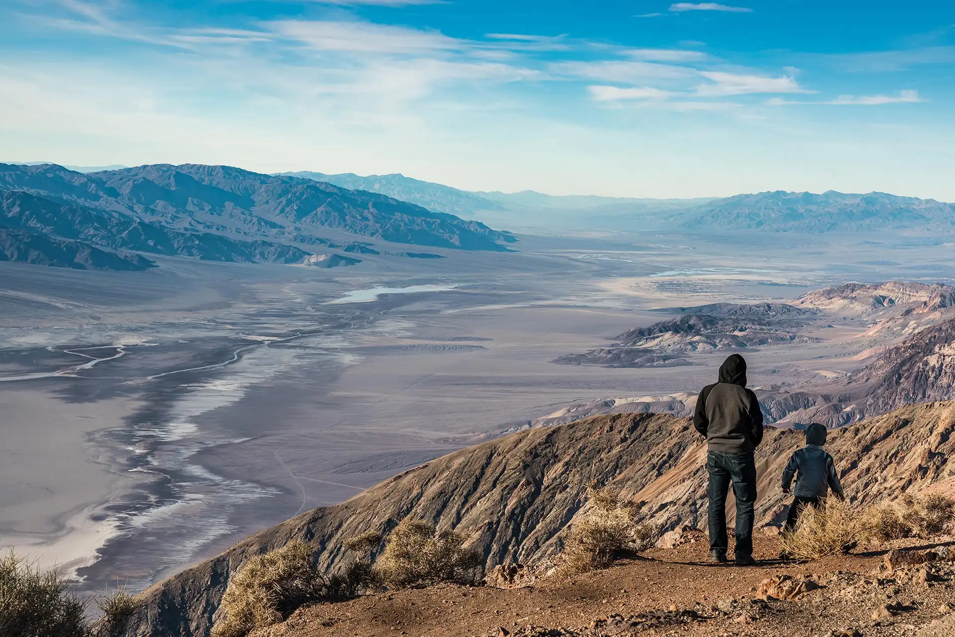 A father and son admiring views of Death Valley National Park from Dante's View in California