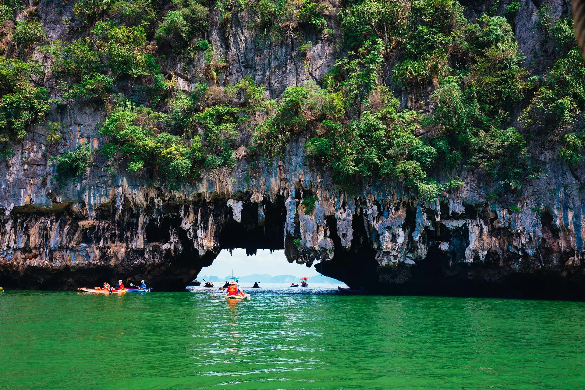 Kayaking through limestone cliffs in Phang-nga Bay in Thailand
