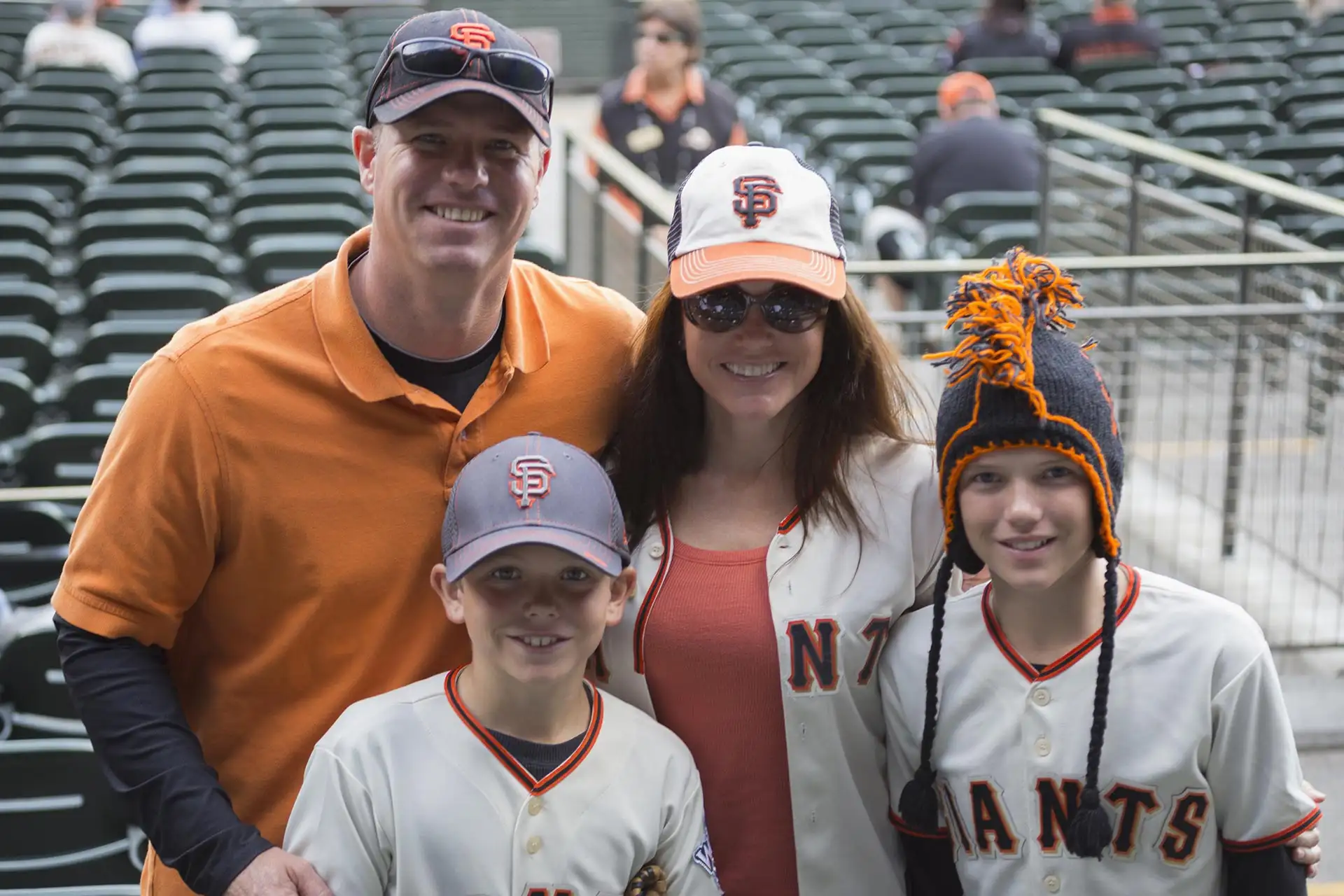 A family at a baseball game in San Francisco, California.