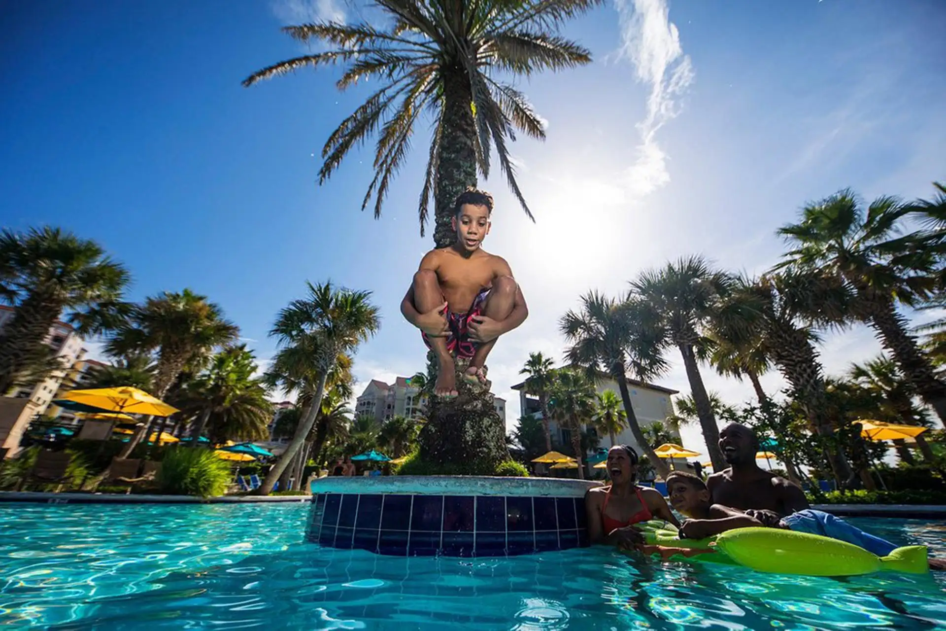 Boy Jumping in Pool at Hammock Beach Resort; Courtesy of Hammock Beach Resort