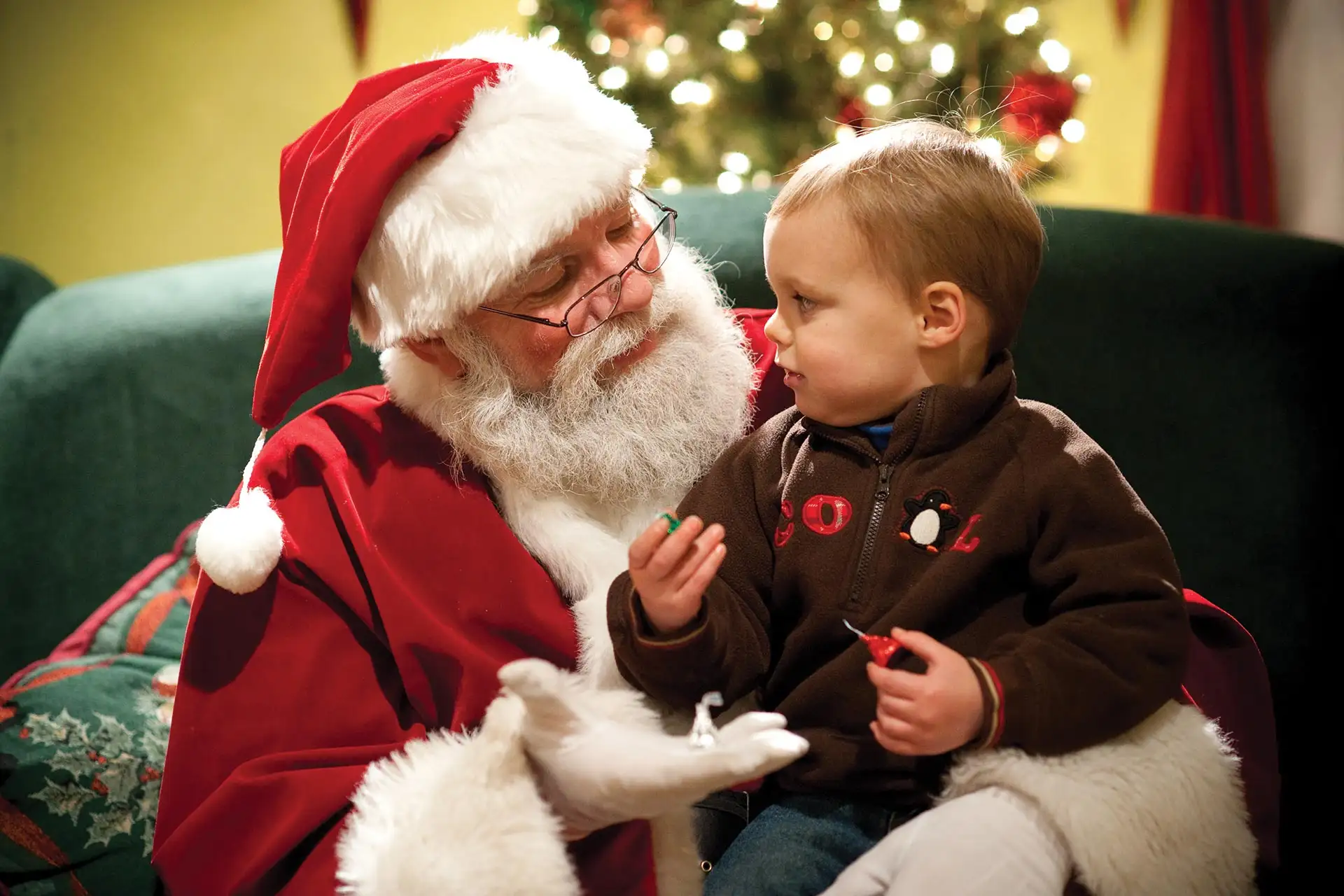 Santa talking to a little boy during Christmas Candylane at Hersheypark in Pennsylvania