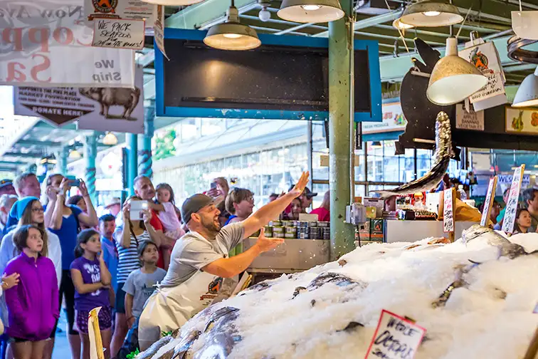 Customers at Pike Place Market; Courtesy of f11photo/Shutterstock.com
