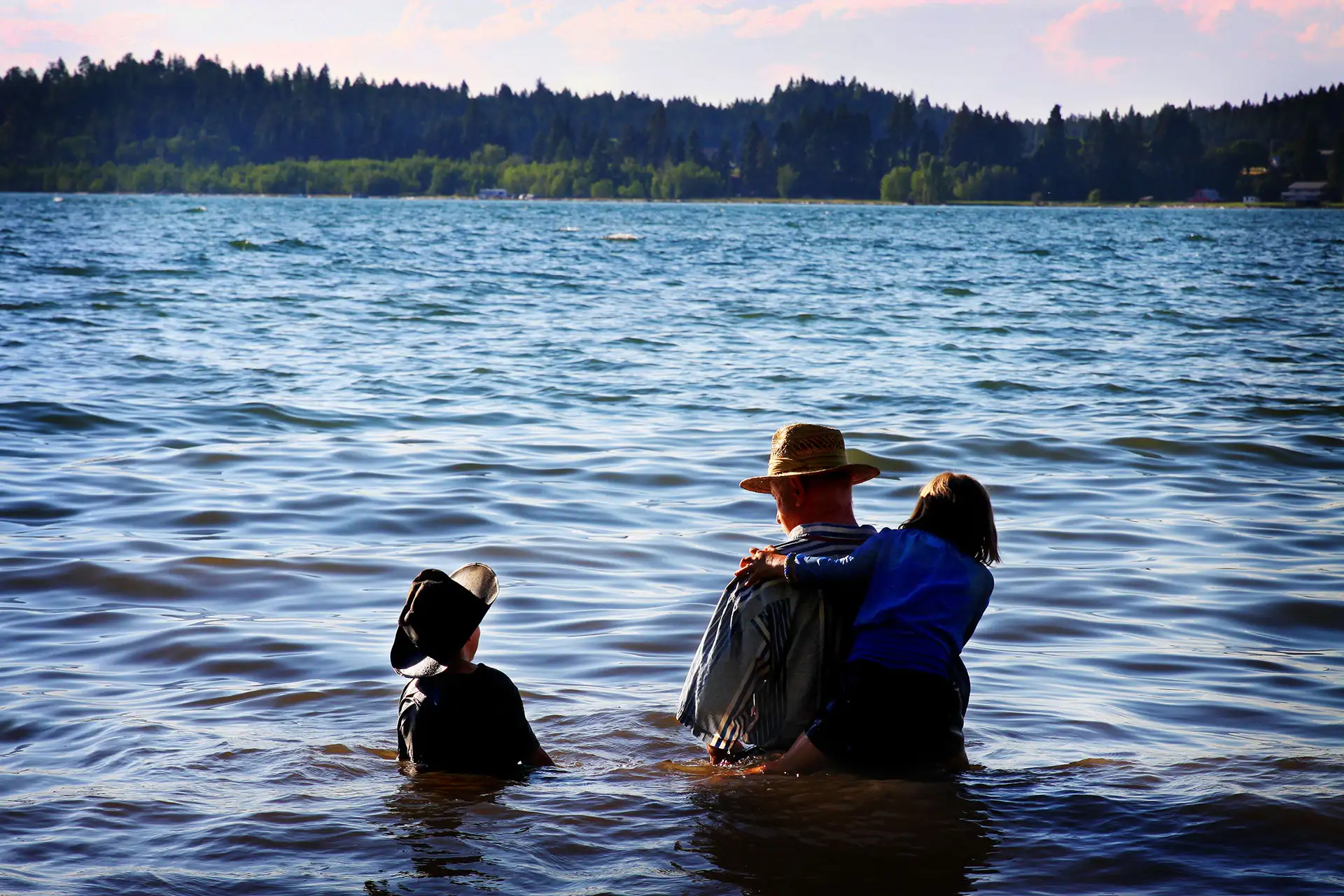 Father and Children Wading in Flathead Lake, MT
